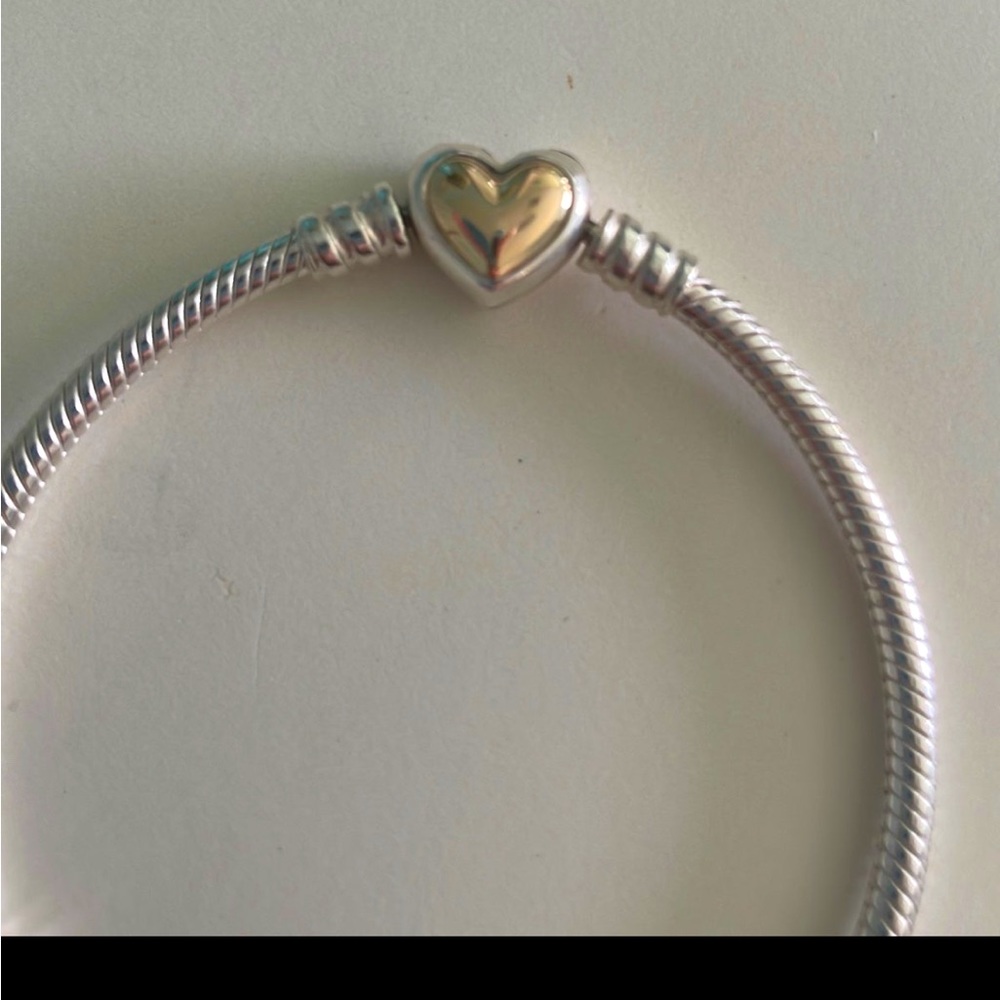 Pandora bracelet, gold and silver. Barely worn